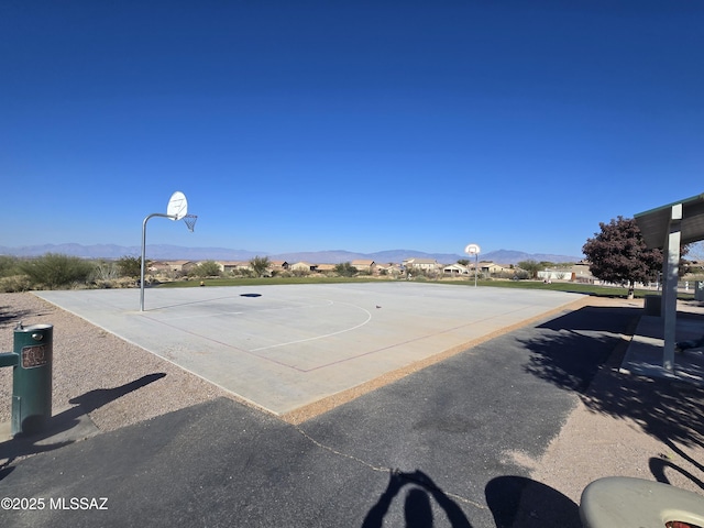 view of basketball court with a mountain view