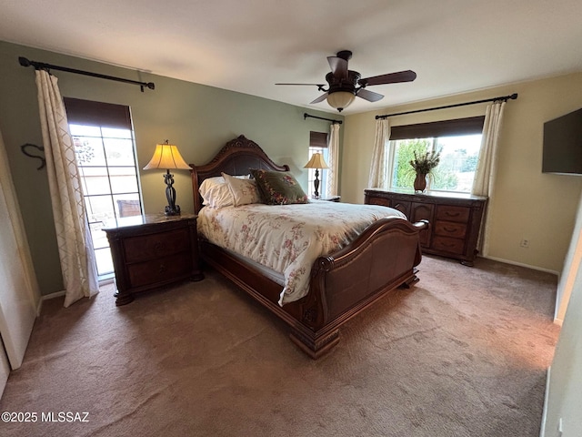 bedroom with ceiling fan and carpet