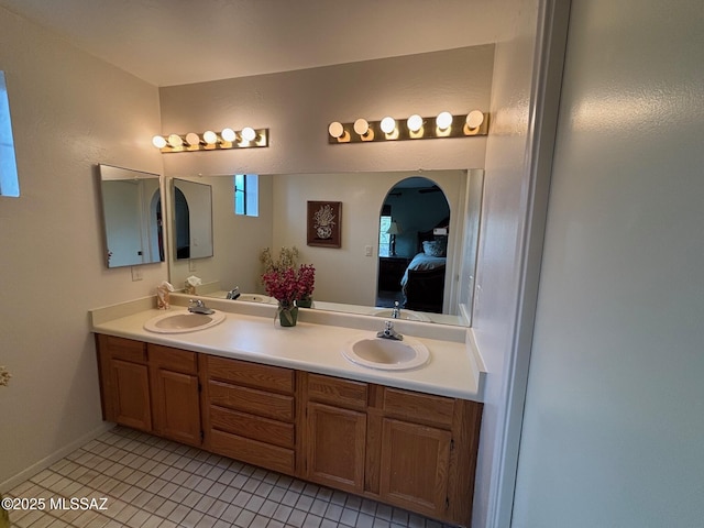 bathroom featuring tile patterned floors and vanity