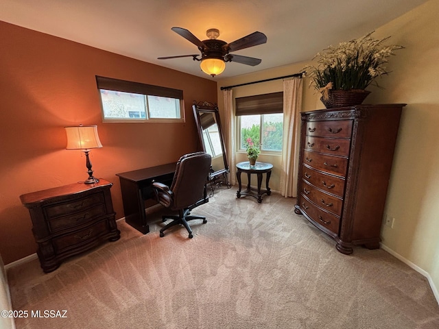 home office with ceiling fan and light colored carpet