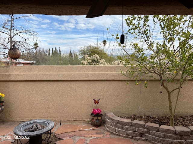 view of patio featuring an outdoor fire pit