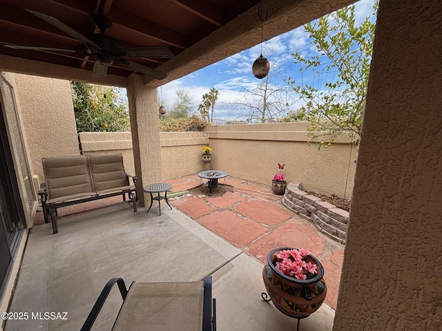 view of patio featuring ceiling fan