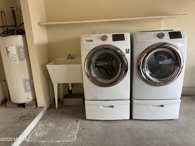 laundry area featuring washing machine and clothes dryer and water heater