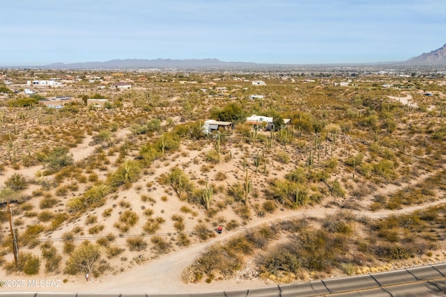 birds eye view of property with a mountain view