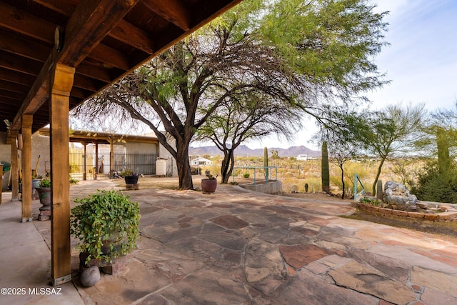 view of patio / terrace featuring a mountain view