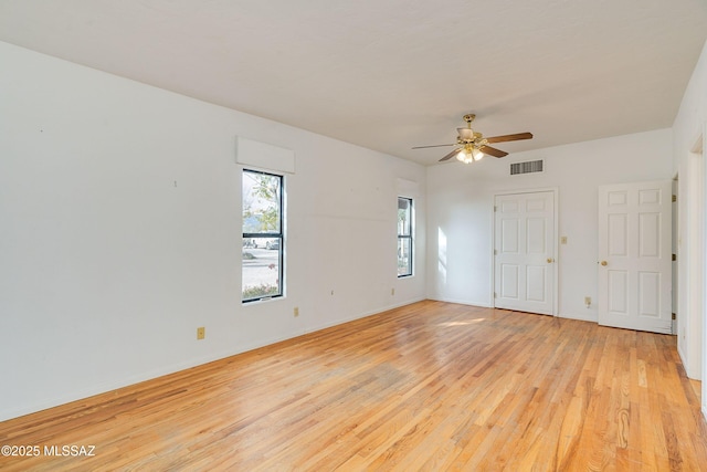 empty room featuring ceiling fan and light wood-type flooring