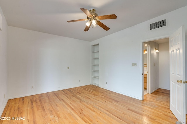 unfurnished room featuring ceiling fan and light wood-type flooring