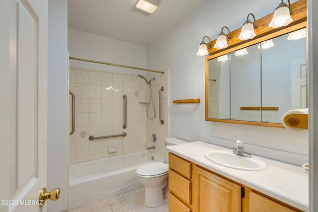 full bathroom featuring tile patterned flooring, vanity, toilet, and tiled shower / bath