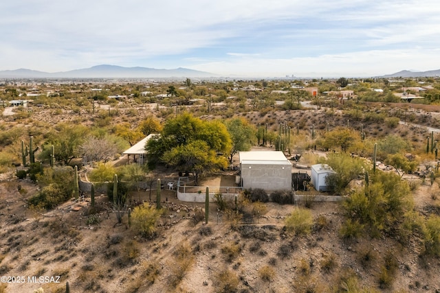 birds eye view of property featuring a mountain view