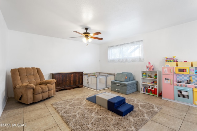 playroom with tile patterned floors and ceiling fan