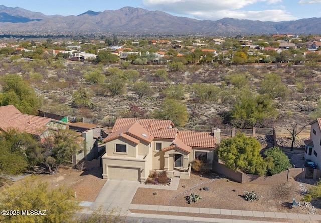 birds eye view of property with a mountain view