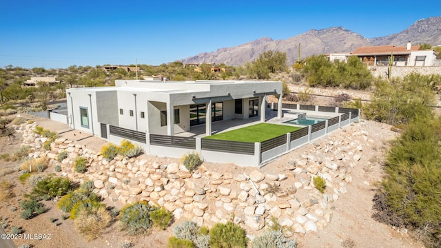 back of property with a mountain view