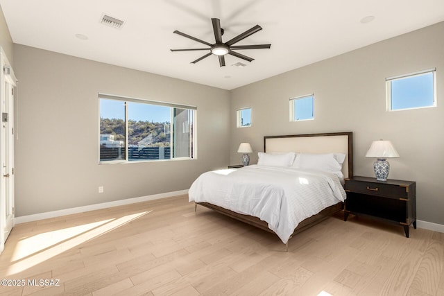 bedroom featuring light hardwood / wood-style flooring and ceiling fan