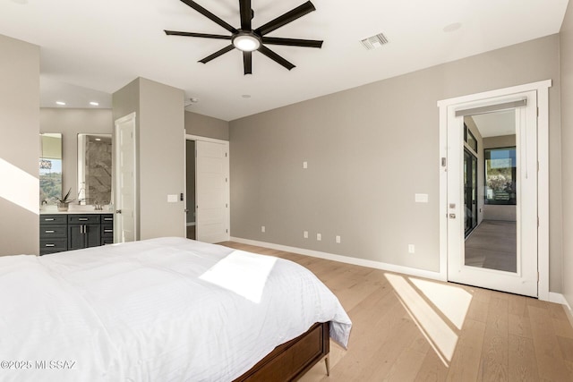 bedroom with ensuite bath, ceiling fan, and light wood-type flooring