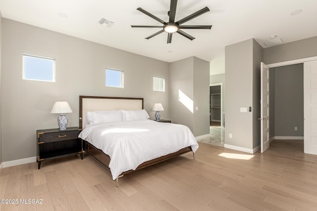 bedroom featuring light hardwood / wood-style floors and ceiling fan