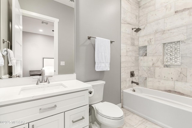 full bathroom with vanity, toilet, and tiled shower / bath combo