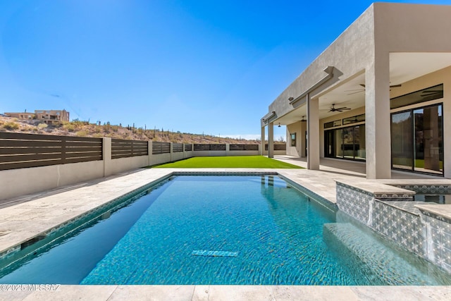 view of pool with a patio area and ceiling fan