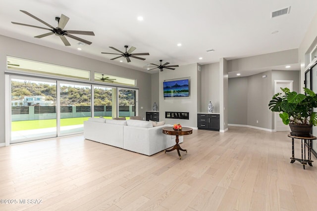 living room with light hardwood / wood-style flooring