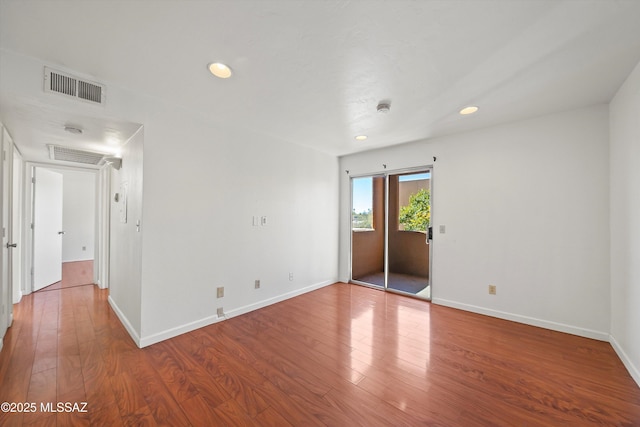 unfurnished room featuring wood-type flooring