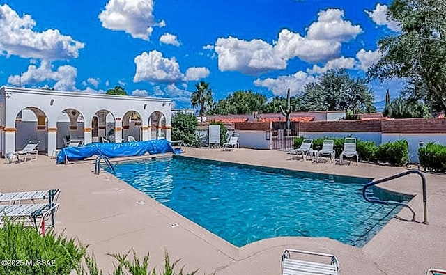 view of swimming pool featuring a patio