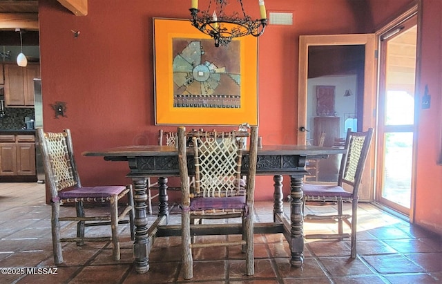 dining room with a notable chandelier