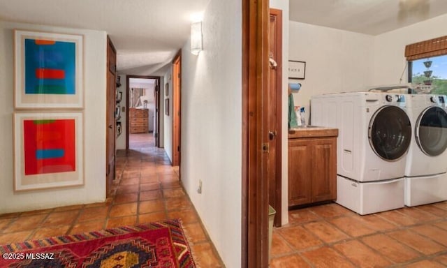 laundry area featuring cabinets and washer and dryer