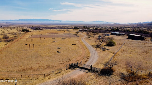 drone / aerial view featuring a mountain view and a rural view