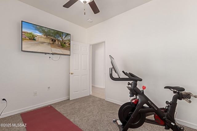 workout room featuring ceiling fan and light carpet