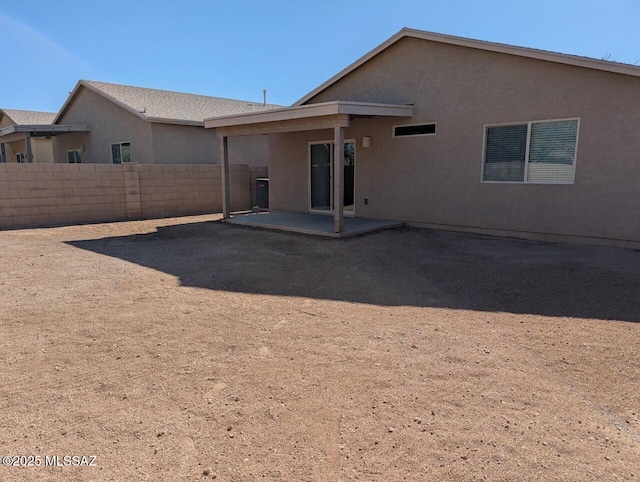 rear view of property featuring a patio