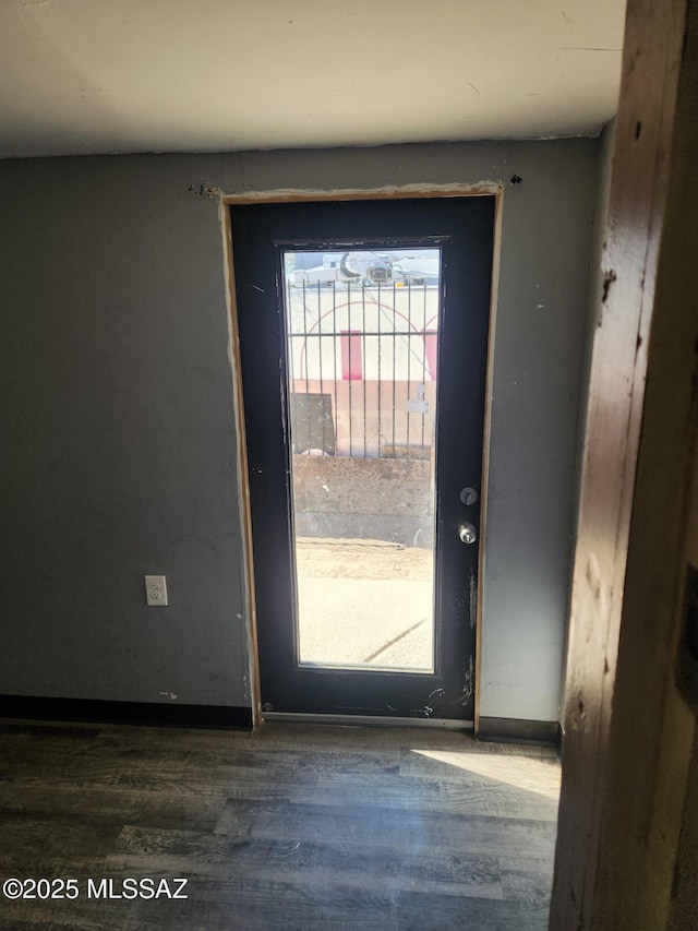 doorway featuring dark hardwood / wood-style floors