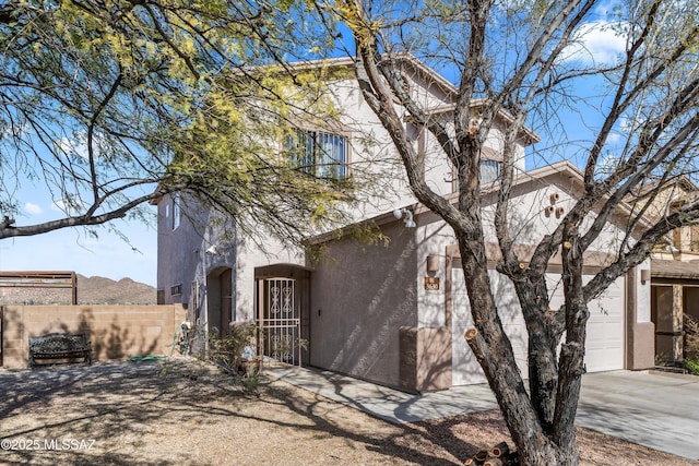 view of front of house with a garage and a mountain view