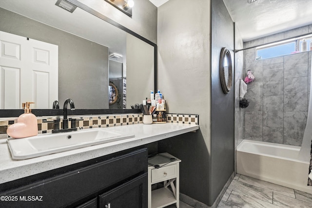 bathroom with tasteful backsplash, shower / tub combo with curtain, and vanity