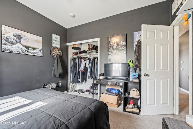 bedroom featuring carpet and a closet