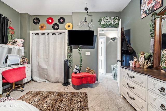 bedroom featuring light colored carpet