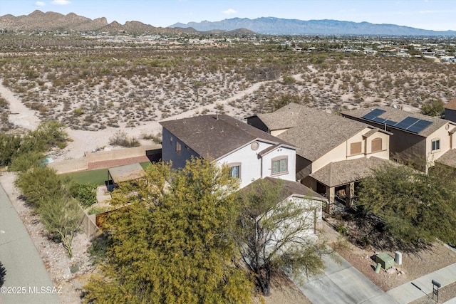 birds eye view of property with a mountain view