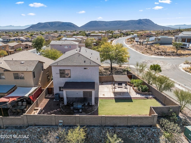 birds eye view of property featuring a mountain view