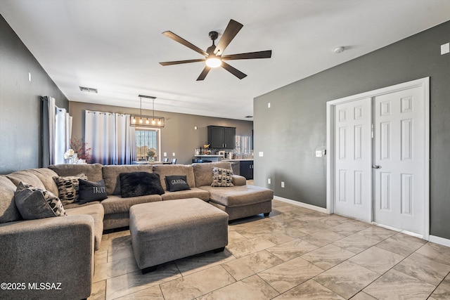 living room with ceiling fan