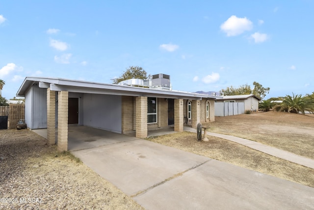 ranch-style home with a carport