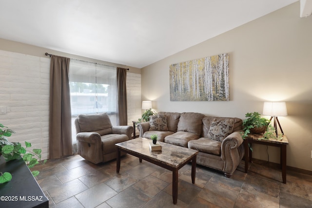 living room featuring vaulted ceiling