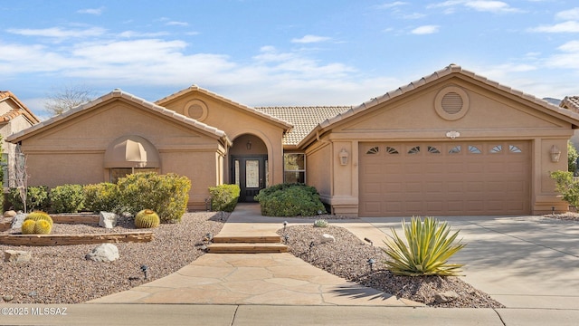 view of front of property with a garage