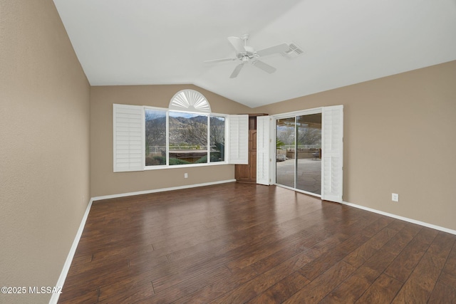 unfurnished room with vaulted ceiling, dark hardwood / wood-style floors, and ceiling fan