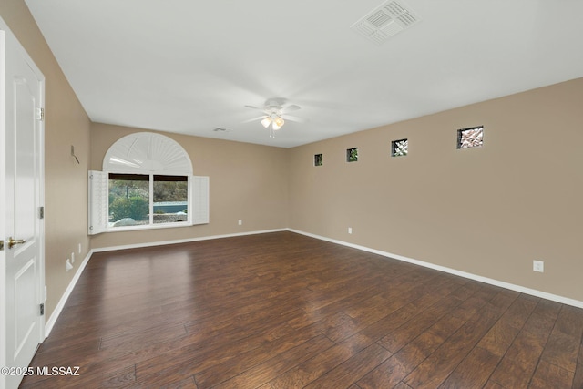 unfurnished room featuring dark hardwood / wood-style flooring and ceiling fan