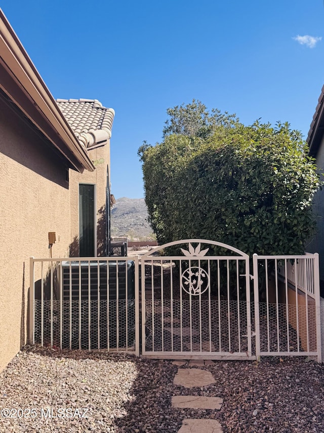 view of gate with a mountain view