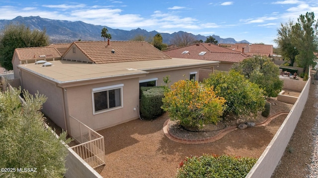 view of home's exterior with a mountain view