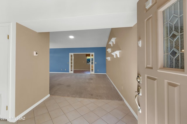 foyer featuring light tile patterned flooring