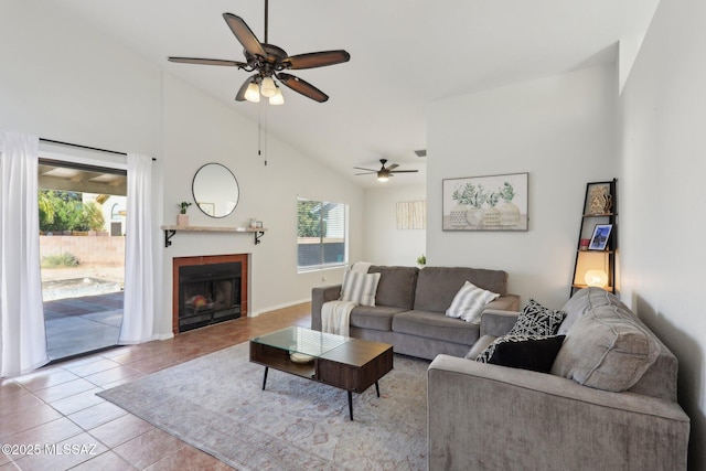 2780 W Camino Llano, Tucson, AZ 85742 - tiled living room featuring a fireplace, a ceiling fan, and high vaulted ceiling