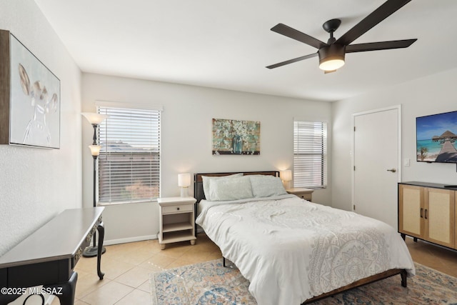 2780 W Camino Llano, Tucson, AZ 85742 - bedroom featuring light tile patterned floors, baseboards, multiple windows, and a ceiling fan