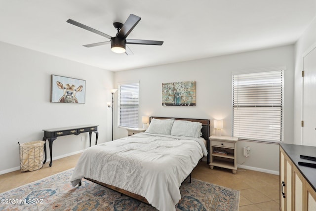 2780 W Camino Llano, Tucson, AZ 85742 - bedroom with light tile patterned floors, baseboards, and a ceiling fan