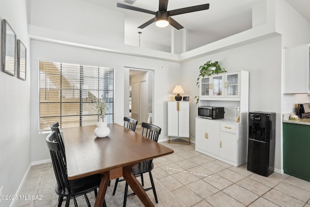 2780 W Camino Llano, Tucson, AZ 85742 - dining area featuring light tile patterned flooring, baseboards, and ceiling fan