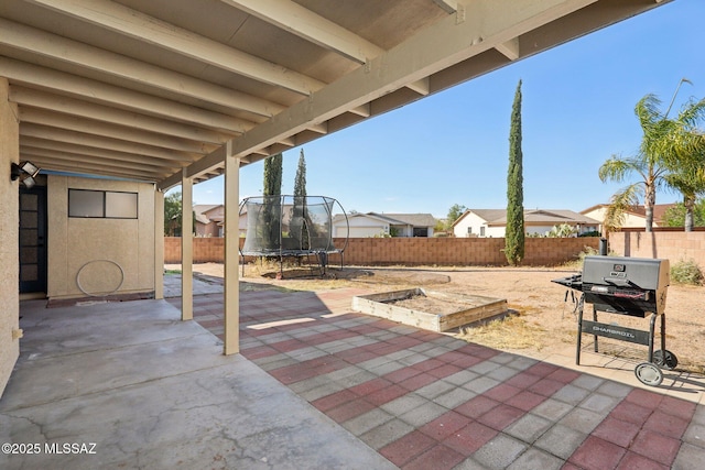 2780 W Camino Llano, Tucson, AZ 85742 - view of patio featuring a trampoline and a fenced backyard